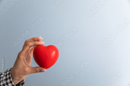 woman holding red heart