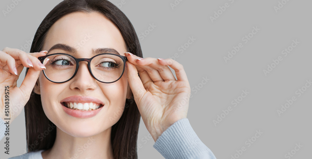 Young beautiful woman isolated portrait. Student girl wearing glasses closeup studio shot, Young businesswoman smiling indoor, People, beauty, student lifestyle, business concept - obrazy, fototapety, plakaty 
