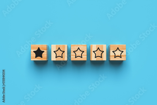 Rating one star. Wooden blocks with stars on a blue background. 3d rendering.