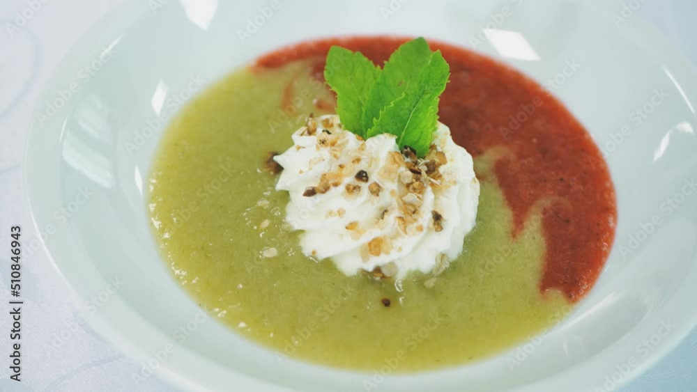 Fruit smoothie with whipped cream and greens Fruit smoothie with whipped cream and greens