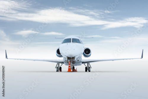 Fototapeta Naklejka Na Ścianę i Meble -  Front view of the luxury corporate airplane isolated on bright background with sky