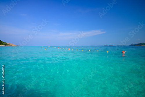 Color buoys and rope nets in the emerald sea at Phi Phi Beach.