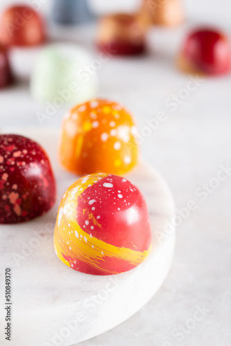 Assortment of painted chocolate pralines. Handcrafted bonbons.Delicious dessert.