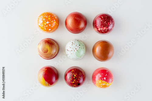 Assortment of painted chocolate pralines. Handcrafted bonbons.Delicious dessert.