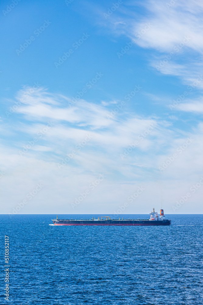 The crude oil tanker Olympic Flag on a calm sea under a blue sky in The Skagerrak off Denmark