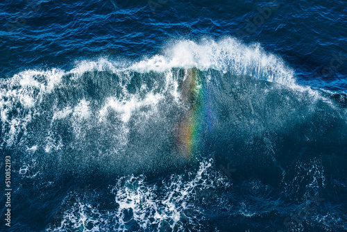 Photography A rainbow seen in the spray of the bow wave of a cruise ship in The Skagerrak of