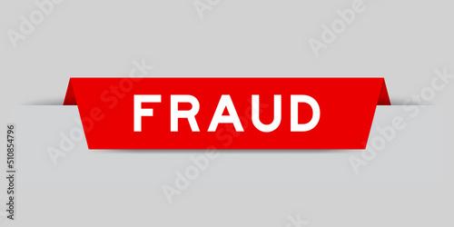 Red color inserted label with word fraud on gray background