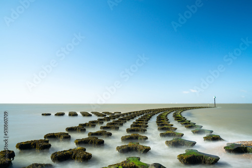 view of the sea defenses at Cobbolds Point near Felixstowe on the North Sea coast of England photo