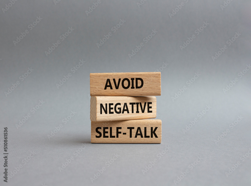 Avoid negative self-talk symbol. Concept words Avoid negative self-talk on wooden blocks. Beautiful grey background. Business and Avoid negative self-talk concept. Copy space. Avoid negative self-talk symbol. Concept words Avoid negative self-talk on wooden blocks. Beautiful grey background. Business and Avoid negative self-talk concept. Copy space.