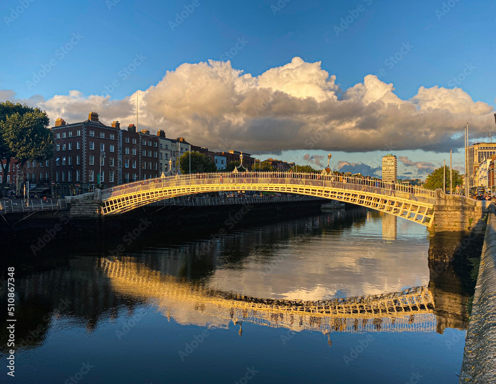 Ha penny bridge over the Liffey river at sunset, Dublin City, Ireland