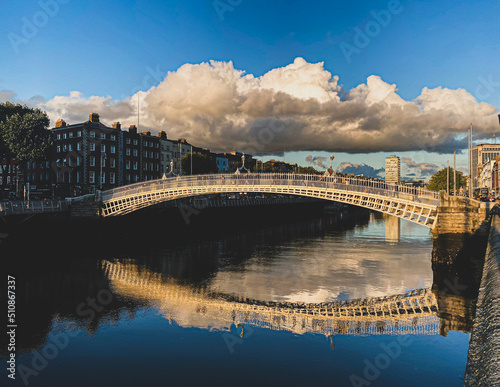 Ha penny bridge over the Liffey river at sunset, Dublin City, Ireland