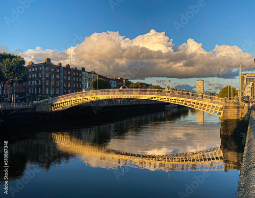 Ha penny bridge over the Liffey river at sunset, Dublin City, Ireland
