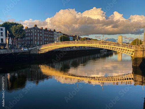 Photography Ha penny bridge over the Liffey river at sunset, Dublin City, Ireland