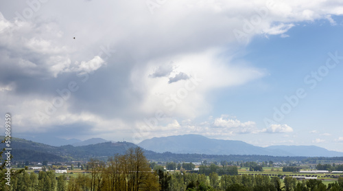 Cloudscape of White Puffy Clouds over the Canadian Mountain Landscape. Mission, British Columbia, Canada. © edb3_16