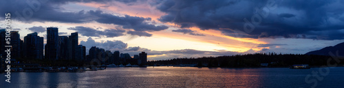 Panoramic View of Coal Harbour, Marina, Modern City and Stanley Park. Dramatic Sunset Sky. Downtown Vancouver, British Columbia, Canada.