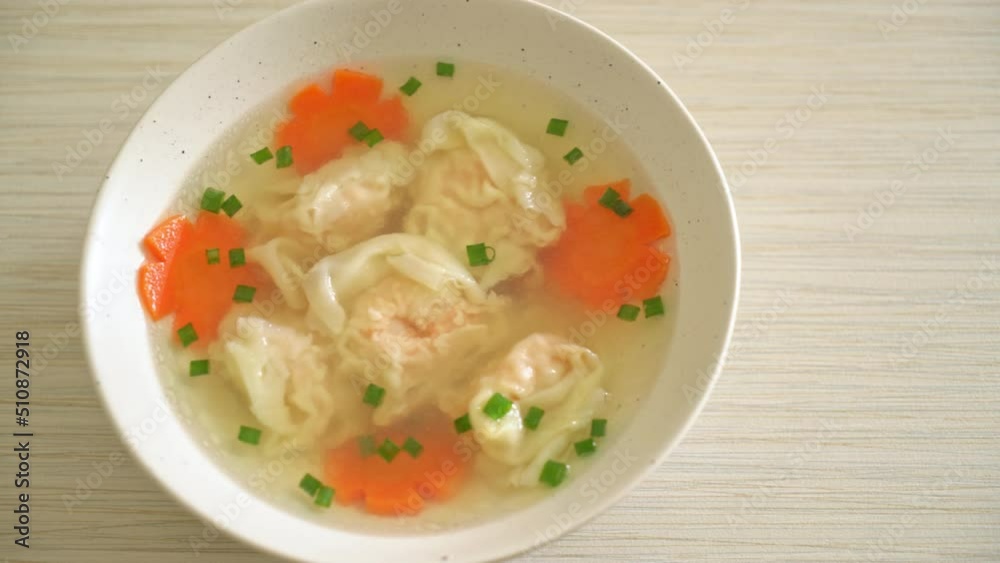 shrimp dumpling soup in white bowl - Asian food style shrimp dumpling soup in white bowl - Asian food style