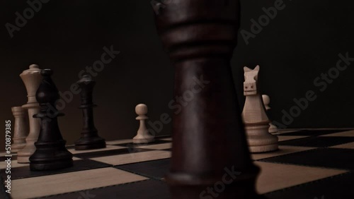 Chess Pieces on Chessboard: Black Queen Moves Vertically Toward the Camera in Slow Motion - View from Pawn's Perspective