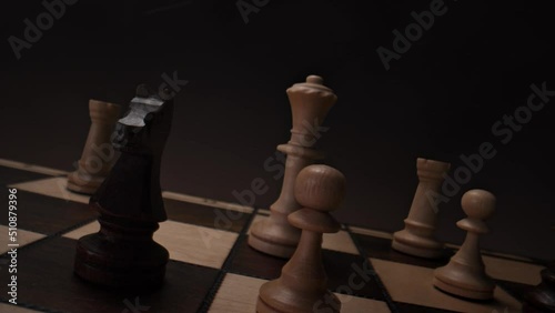 Chessboard with Chess Pieces: Macro Shot of Black Motionless Knight and Black Bishop Moving Diagonally in Slow Motion - View from Pawn's Perspective