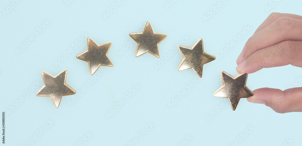 Rise on increasing five stars in human hand Rise on increasing five stars in human hand