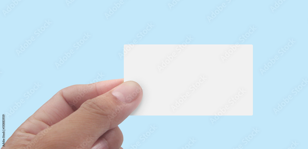 Fototapeta premium Close up of hand holding virtual card with. Credit card in hand