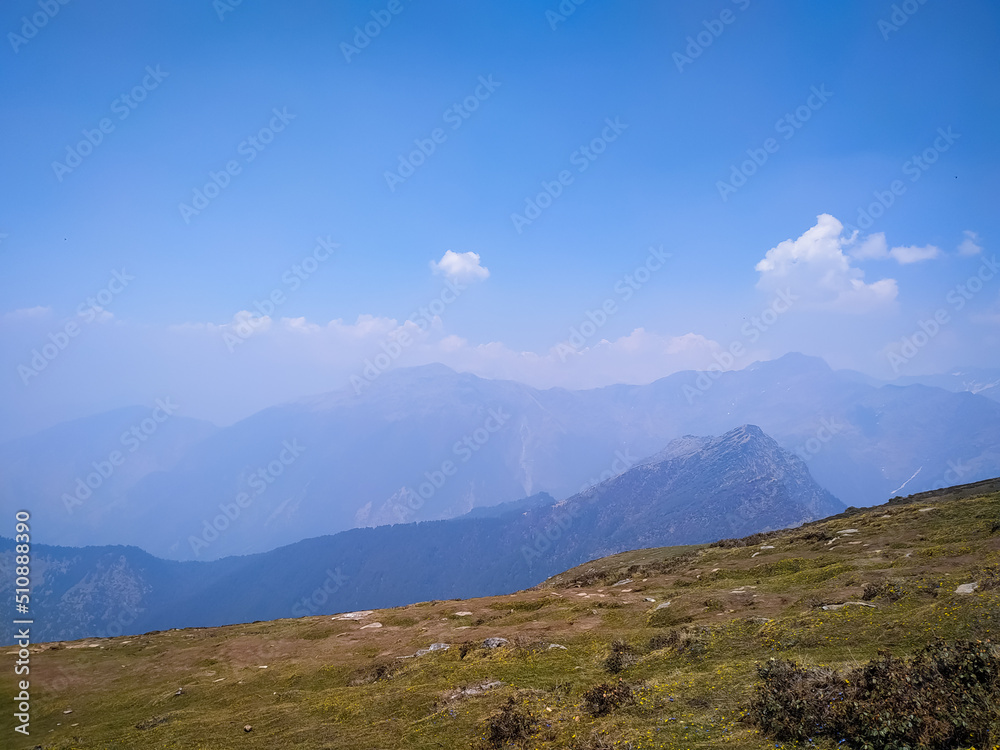 A beautiful view of mountain landscape with clouds and blue sky