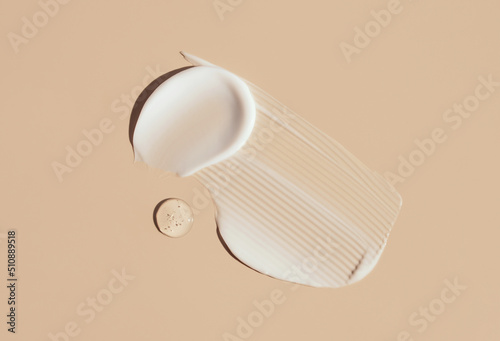 cosmetic smears cream texture on pastel background