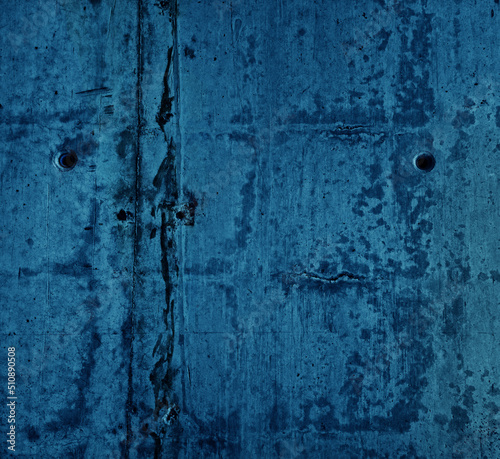 smooth blue raw concrete wall with concrete form dimples, grid lines and dark rusty on its texture. cement stone texture background. blue concrete texture with dirty stripes along.