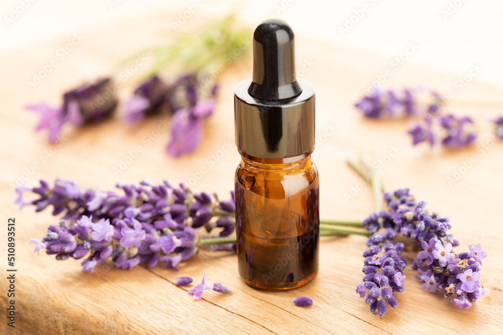 Fototapeta premium Lavender essential oil still life. Herbal remedies