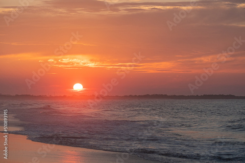 Ocean waves at sunrise off the shore of Cape May , New Jersey USA © John McAdorey