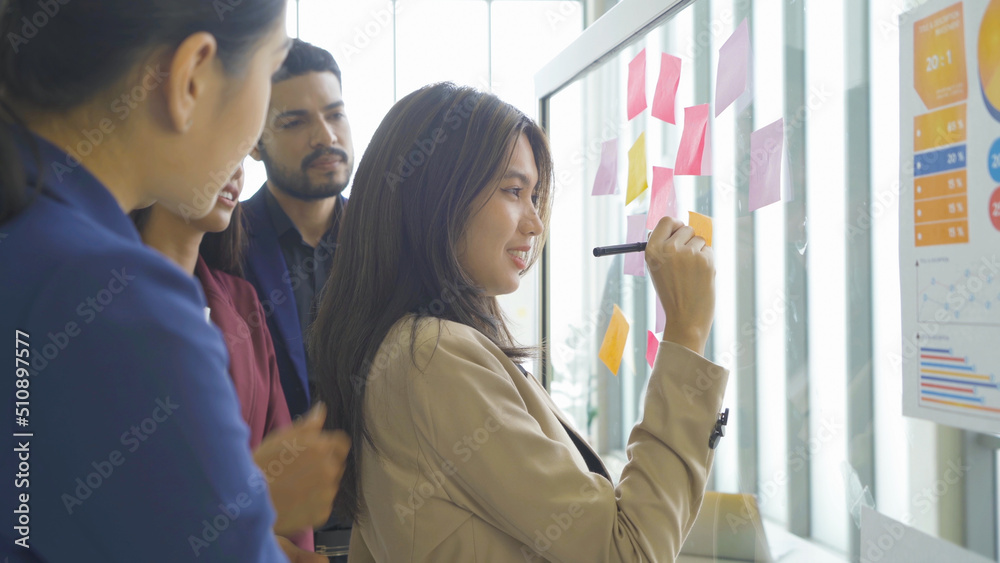 A group of Asian business team talk, communicate, discuss, and work in meeting room office, present ideas to colleagues. People lifestyle. Corporation A group of Asian business team talk, communicate, discuss, and work in meeting room office, present ideas to colleagues. People lifestyle. Corporation