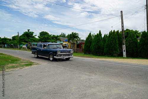 classic old cars on the streets of cuba in rural surrounding © chriss73