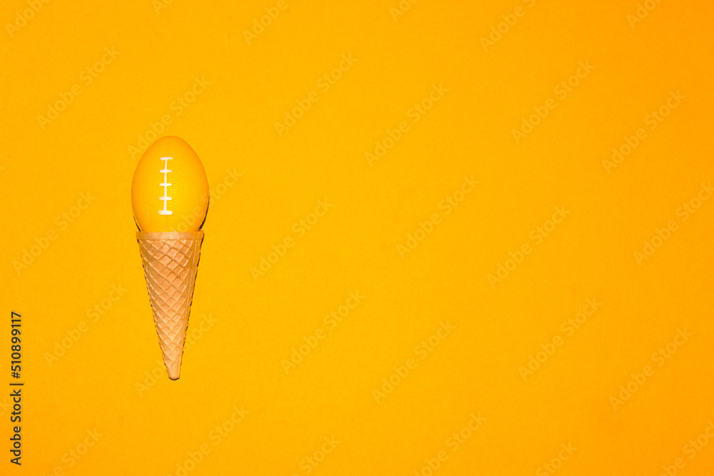 ice cream cone with ball for american football instead of ice cream ball, creative art design, slow ice cream on yellow background
ice cream cone with ball for american football instead of ice cream ball, creative art design, slow ice cream on yellow background