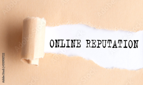 The text ONLINE REPUTATION appears on torn paper on white background.