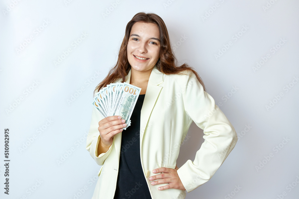 Beautiful girl counts money holding them in her hands. Business and profit concept. Beautiful girl counts money holding them in her hands. Business and profit concept.