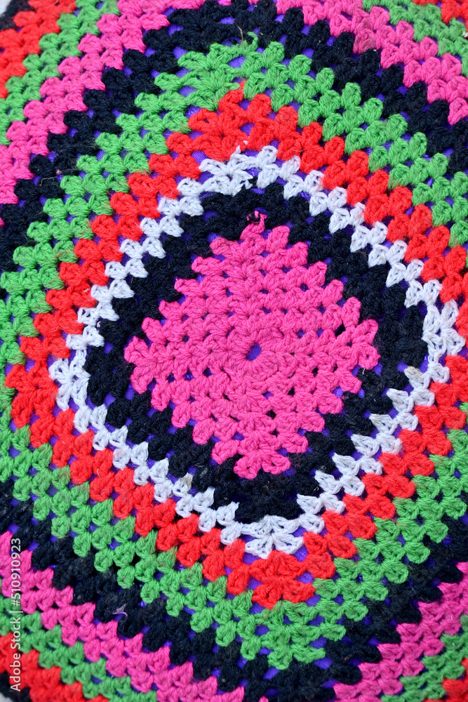 closeup the hand made multicolor thread shape soft focus natural green pink background.