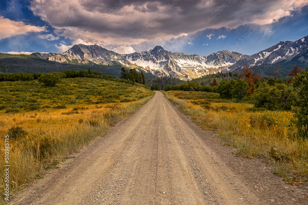 Unpaved Colorado County Road 9 goes towards San Juan Mountain Range Near Telluride Colorado USA