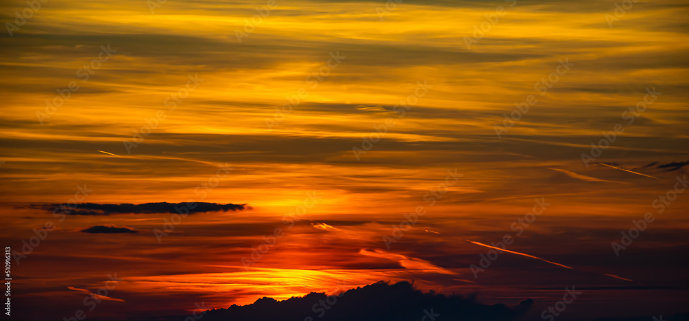 colorful sunset illuminating the sky yellow and red