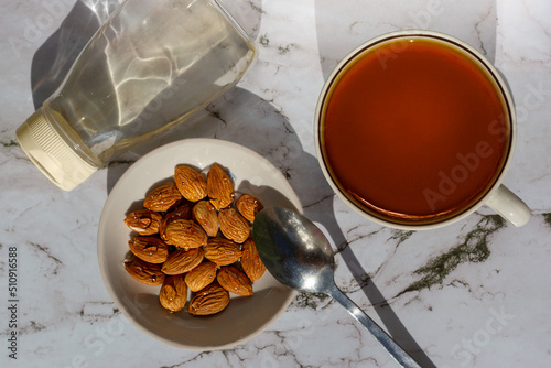 Almonds in chicory syrup and tea. View from above. photo