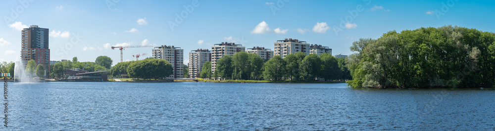 Panorama of recreational lake Sloterplas and Apartment buildings in Osdorp neighbourhood of Amsterdam Panorama of recreational lake Sloterplas and Apartment buildings in Osdorp neighbourhood of Amsterdam