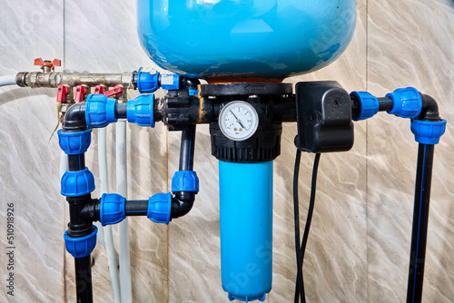 Pressure tank store and supply water to house under pressure with help of compressed air. photo