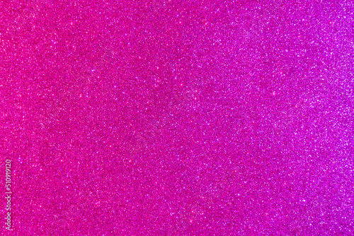 Background with sparkles. Backdrop with glitter. Shiny textured surface. Strong pink photo