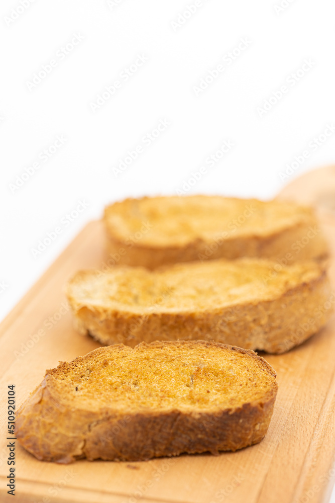 Baked bread with olive oil on the baking pan