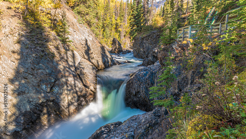 Nature scenes in northern Canada with water flowing over rock face at Million Dollar Falls in Canada. 