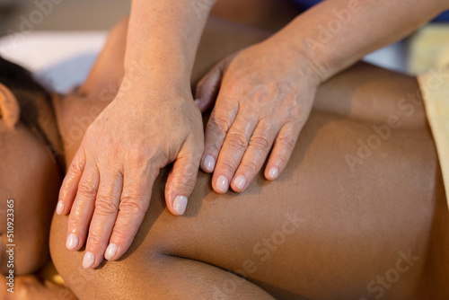 back massage of a young african woman