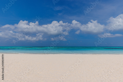 Closeup sand beach sea waves and blue summer sky. Panoramic beach landscape. Empty tropical beach and seascape, horizon. Bright exotic coast calmness, tranquil seaside nature view relaxing sunlight