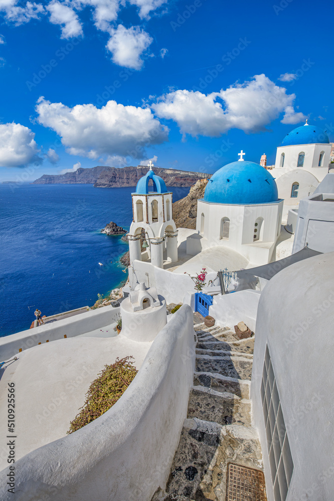 Europe summer destination. Traveling wallpaper, sunny scenic famous landscape of Santorini island, Oia, Greece. Caldera view, idyllic clouds, dream cityscape. Vacation panorama, amazing outdoor scene