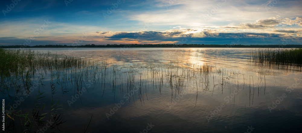 The nature of Belarus, a serene summer morning, a bright dawn on Lake Selyava