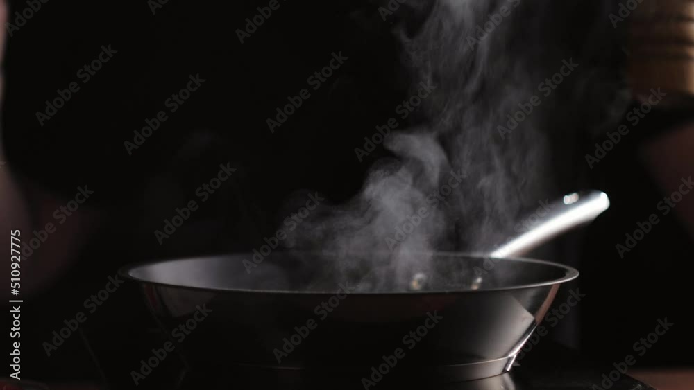 Cooking mushrooms with cream. Pouring sauce into roasting champignons in a frying pan close-up, vegetarian healthy meal. Cooking mushrooms with cream. Pouring sauce into roasting champignons in a frying pan close-up, vegetarian healthy meal.