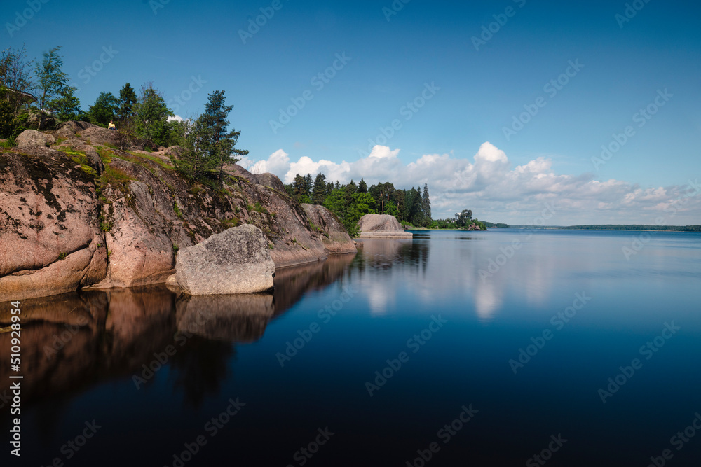 Naklejka premium Aerial landscape view of Monrepo park in Vyborg city. Summer, green forest, island, castle, blue sky . High quality photo