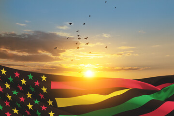 Juneteenth Flag and flying birds on background of sunrise or sunset. Since 1865. Design of Banner with place for text. 3d-rendering.